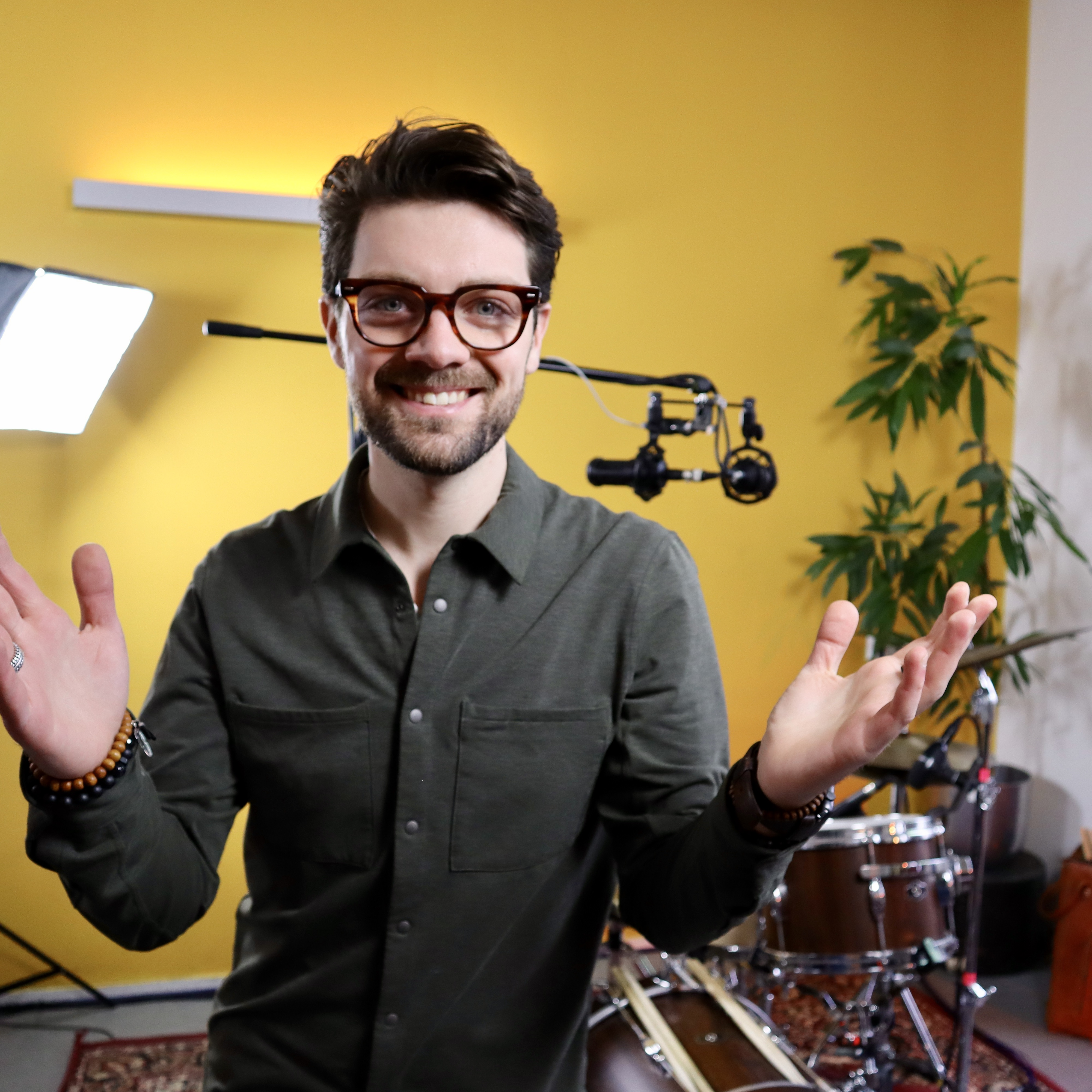 Child enjoying playing the drums